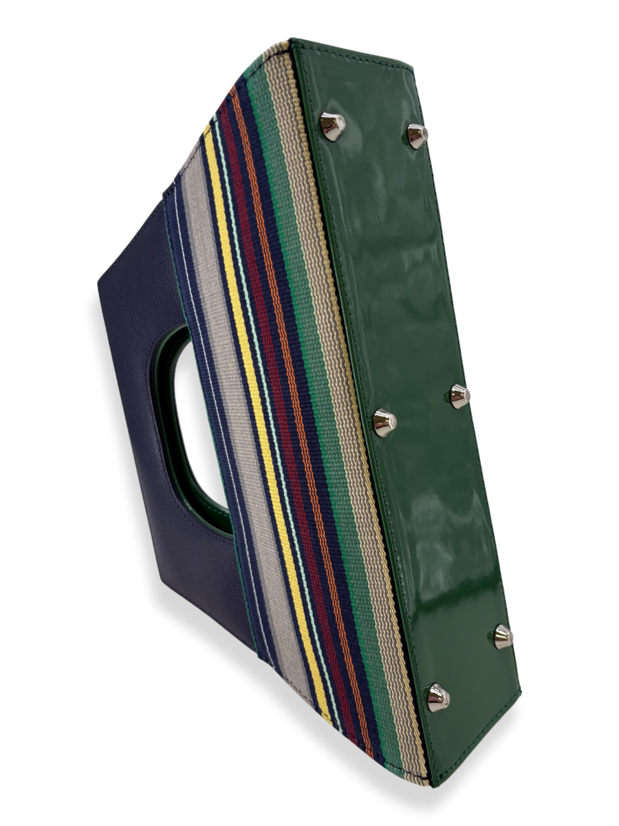 Striped bag with a navy top handle and colorful horizontal stripe bottom section by kuskaya and sold at qinti the peruvian Shop.