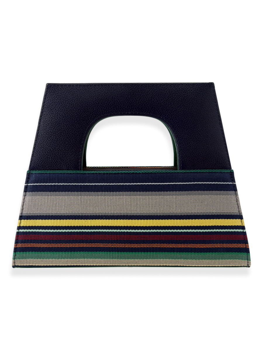 Striped bag with a navy top handle and colorful horizontal stripe bottom section by kuskaya and sold at qinti the peruvian Shop.