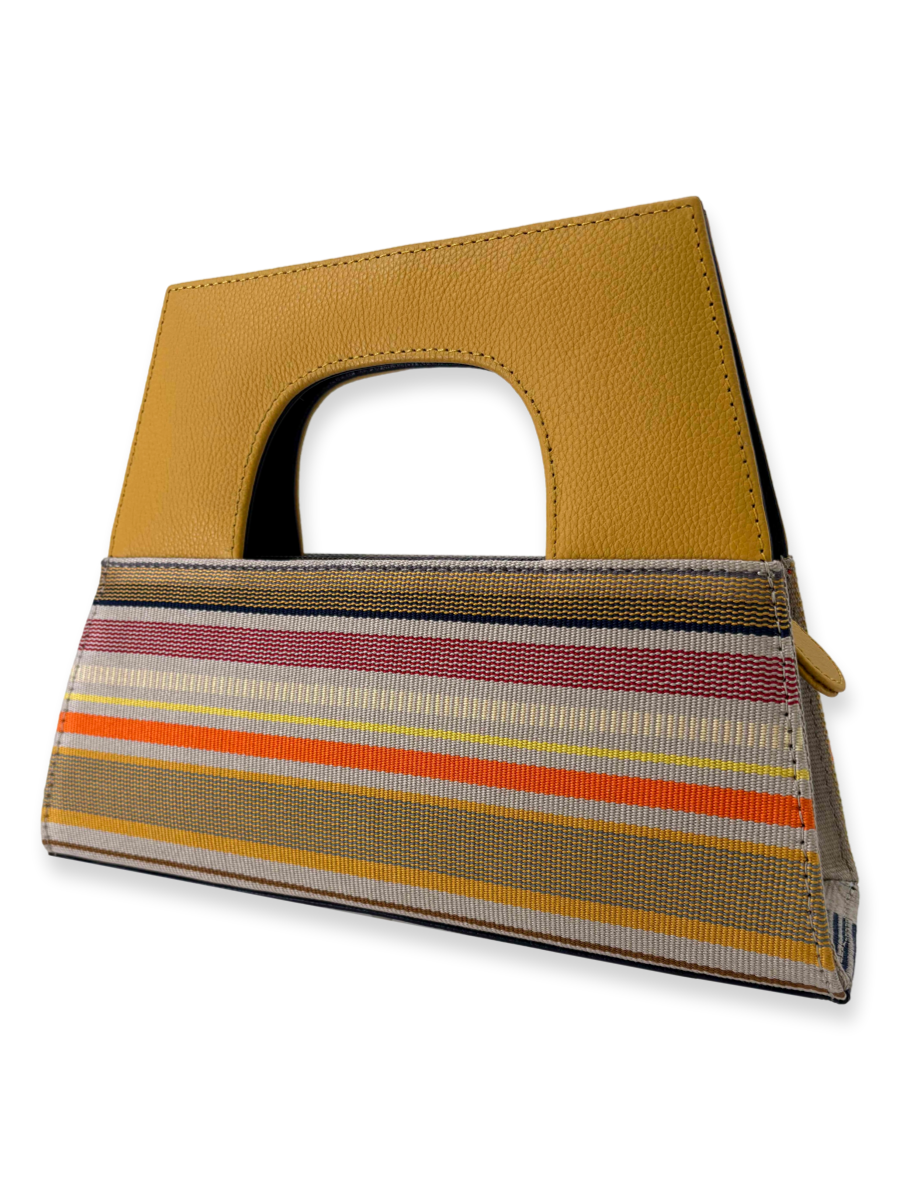 Luxury Peruvian Pima cotton A-handle handbag with yellow pebbled leather handle and multicolor woven striped design.