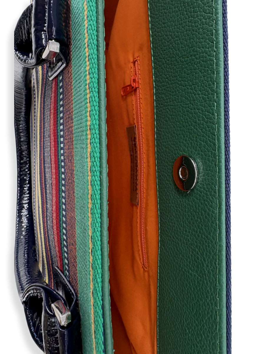 Amanda Grande luxury handbag interior featuring vibrant orange lining, zippered pocket, phone pouch, magnetic snap closure, and premium leather trim