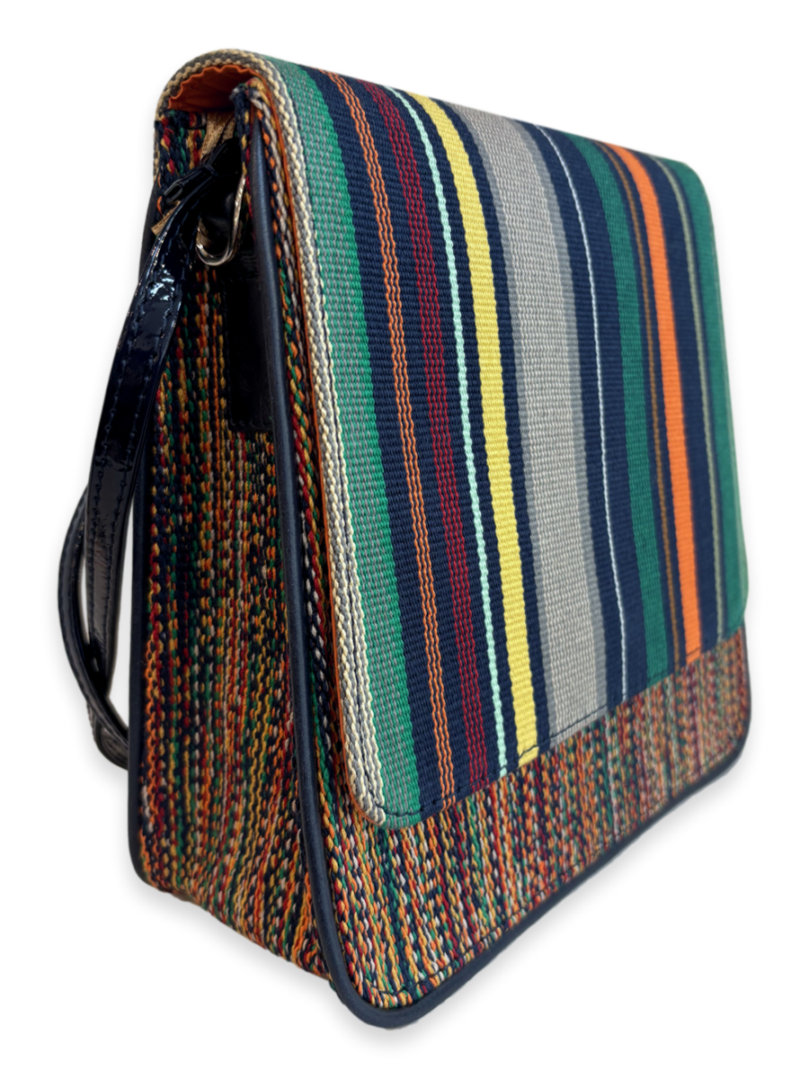 Close-up of the Cocktail luxury handbag showcasing handwoven mercerized Peruvian Pima cotton, navy patent leather accents, smooth leather trim, and premium craftsmanship.