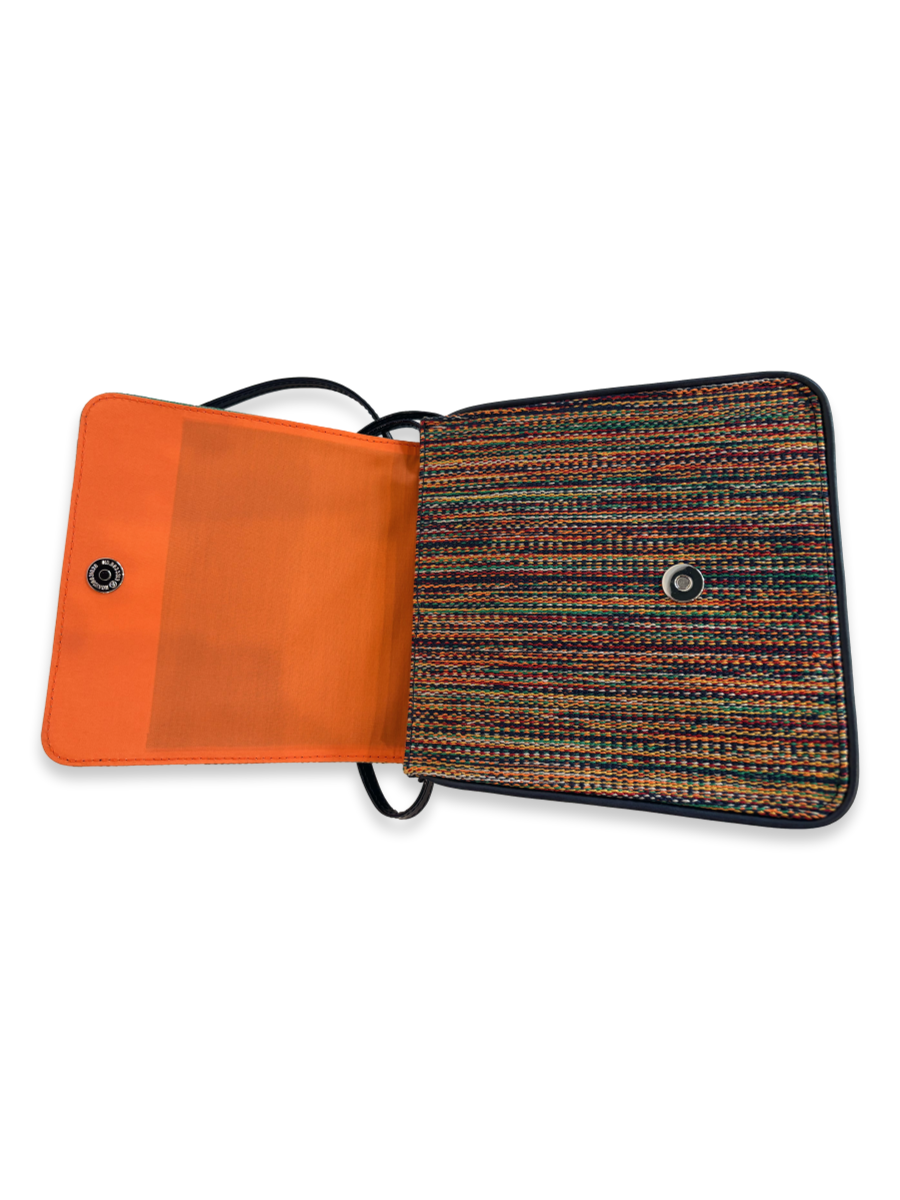 Cocktail crossbody handbag with vibrant orange lined interior, zippered pocket, elastic phone pouch, magnetic snap closure, and premium leather detailing.