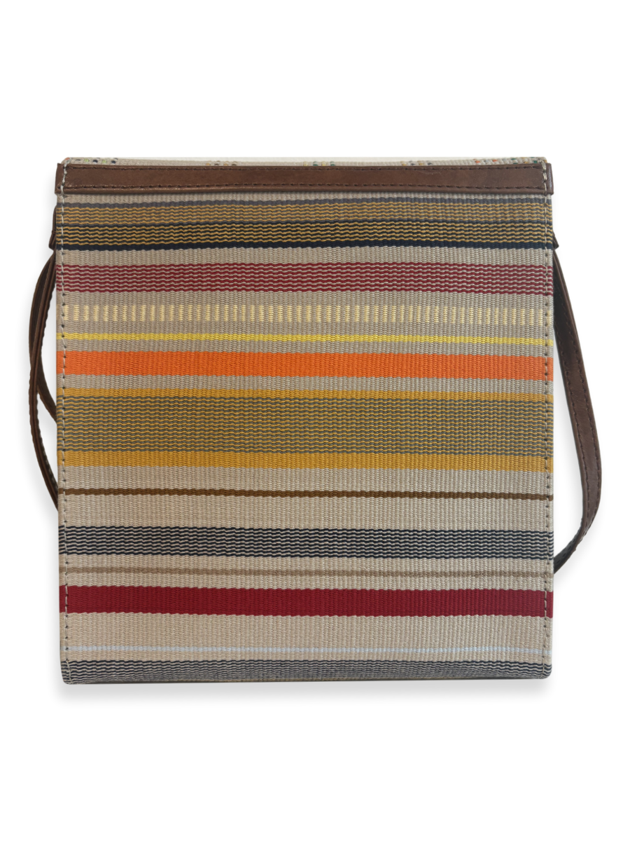 Back view of the Curva luxury crossbody handbag handcrafted in Peru with handwoven mercerized Peruvian Pima cotton, contemporary striped textile, and smooth tan leather trim.