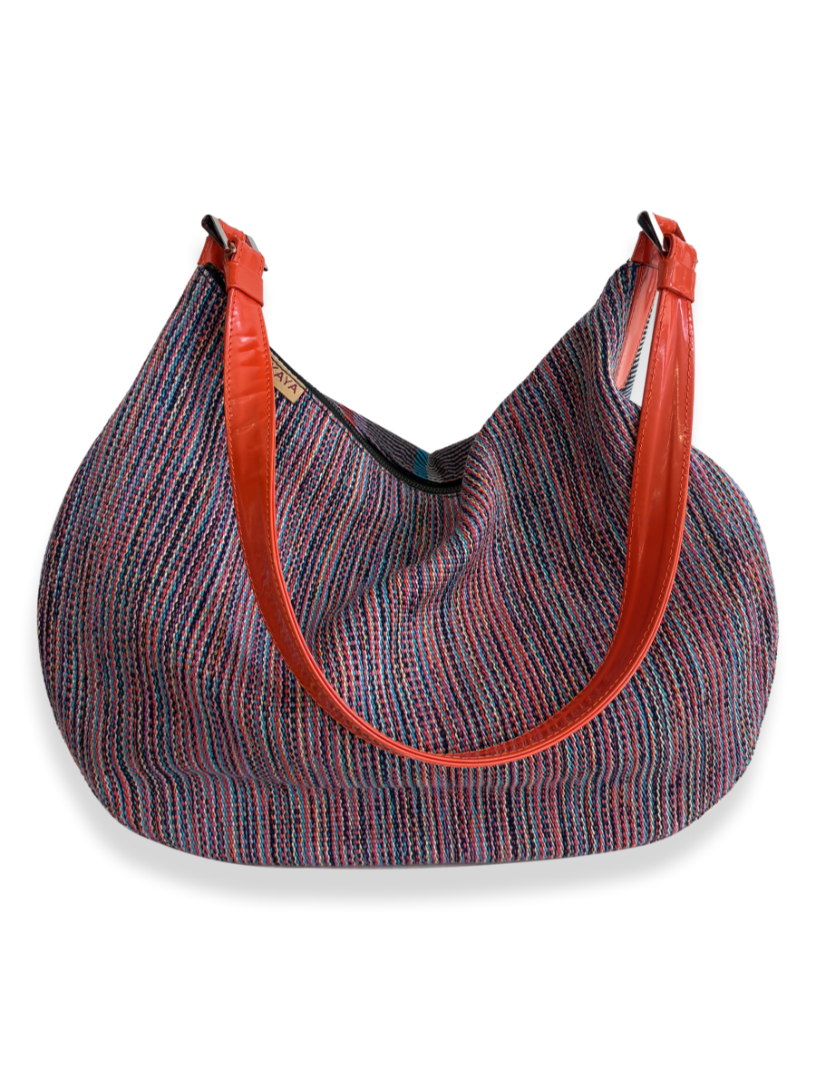 One-of-a-kind Media Luna handbag by Kuskaya made from mercerized Pima cotton from Peru, featuring a crescent shape, multicolored striped textile, double-sided design, and leather trim with a wide shoulder strap. From QINTI The Peruvian Shop.