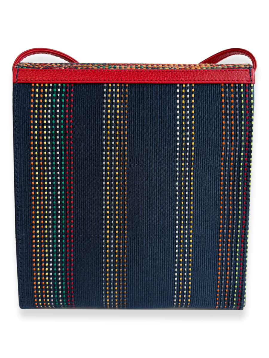 One-of-a-kind Pima cotton crossbody handbag by Kuskaya, featuring a multicolor woven flap, navy striped body, and red leather strap, available at Qinti The Peruvian Shop.