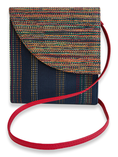One-of-a-kind Pima cotton crossbody handbag by Kuskaya, featuring a multicolor woven flap, navy striped body, and red leather strap, available at Qinti The Peruvian Shop.