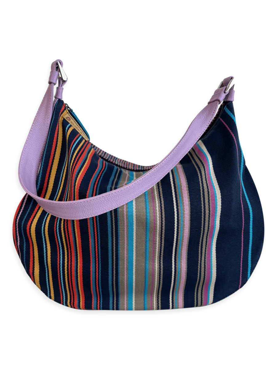 One-of-a-kind Kuskaya shoulder handbag, crafted from striped multicolor Pima cotton with smooth leather panels, a wide lilac leather strap, and a soft lilac interior; slouchy, crescent shape with artisanal Peruvian design - QINTI The Peruvian Shop