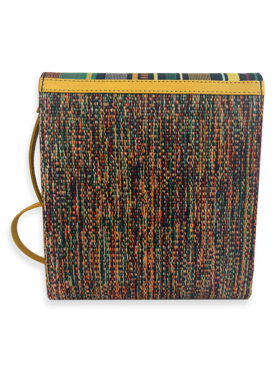 Back view of the Curva Navy Multi designer crossbody bag handcrafted in Peru with richly woven mercerized Peruvian Pima cotton, yellow pebbled leather trim, and a lightweight contemporary silhouette.