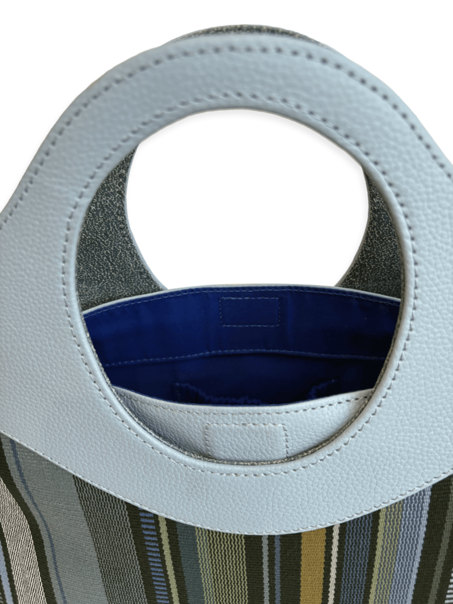 Kuskaya Handbag with Green base, and vertical stripes. powder blue pebbled leather Handle. One-of-a-kind Handbag from Qinti The Peruvian Shop.