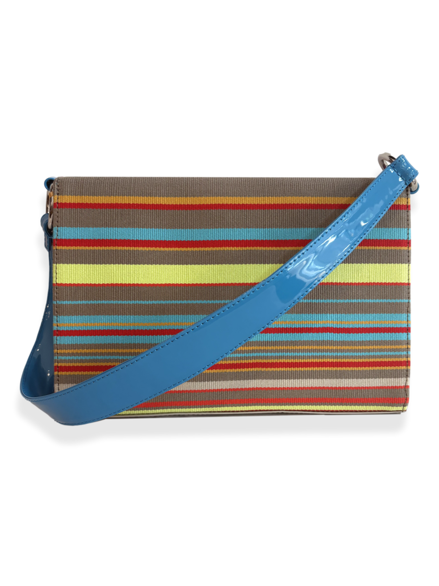 Multicolored striped bag with a blue strap made with mercerized pima cotton and patent leather. Designed by kuskaya and sold at qinti the pweruvian shop