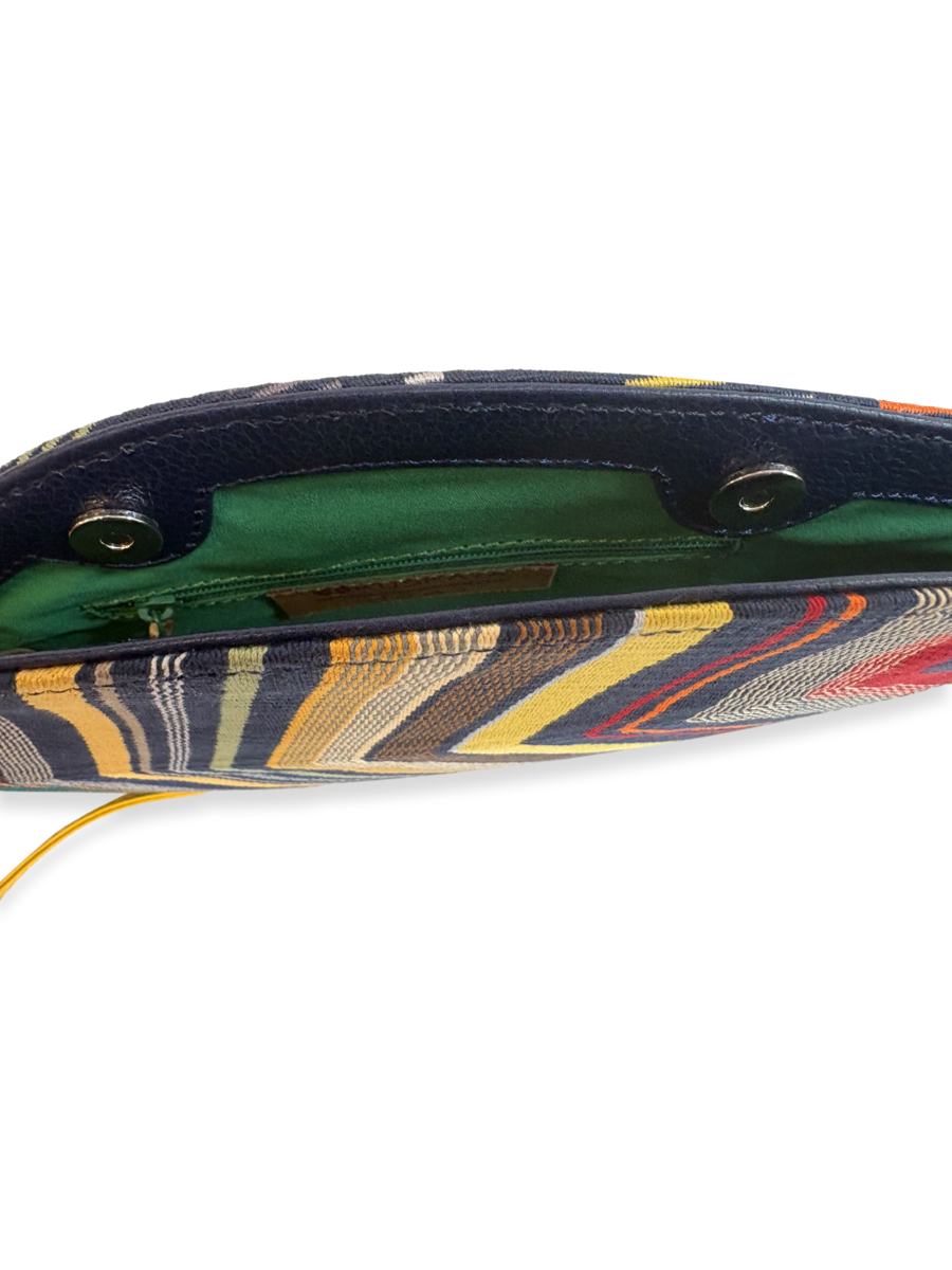 Interior view of the Hoja Navy Multi 01 Pima cotton crossbody handbag with smooth yellow leather detailing and bright green lining, handcrafted in Peru.