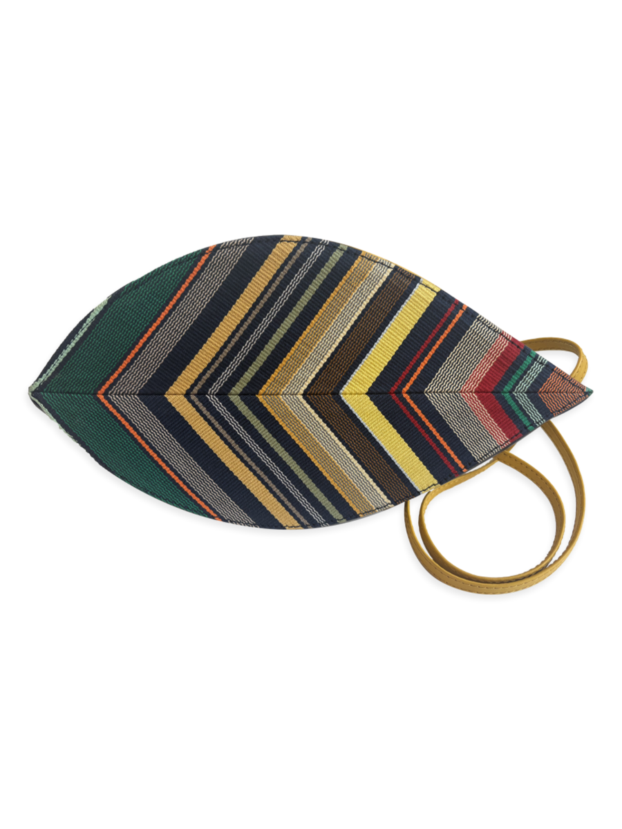 Angled view of the Hoja Navy Multi 01 crossbody handbag showing its leaf-inspired silhouette, woven Pima cotton textile, smooth yellow leather strap and navy pebbled leather base.